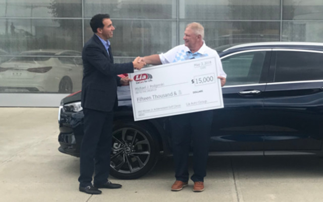 Bill Lia Jr. presents $15,000 check to Hole-in-One Contest Winner
